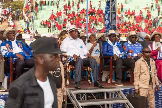 (FILES) Central African Republic's President and presidential candidate for the United Hearts Movement (MCU) Faustin Archange Touadera (C) sits on stage during his final rally in Bangui on December 26, 2025 ahead of CAR's presidential election on December 28, 2025. The Central African Republic has re-elected President Faustin Archange Touadera, according to provisional results released by the electoral authority on January 6, 2026. (Photo by Annela NIAMOLO / AFP)