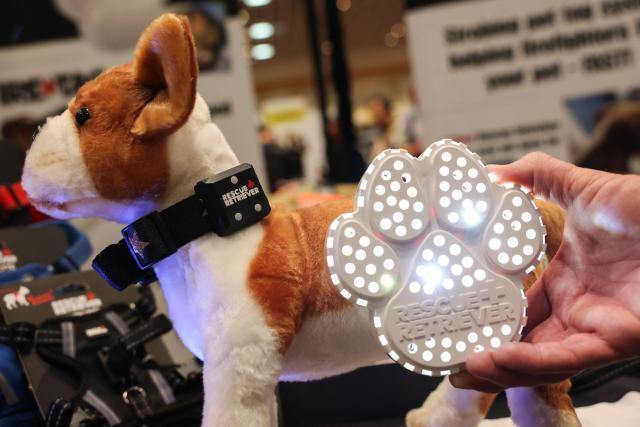 The Rescue Retriever Pet Smoke Detector, featuring a silent strobing smoke detector to help firefighters find pets in fires, is demonstrated during Pepcom ahead of the annual Consumer Electronics Show (CES) in Las Vegas, Nevada on January 5, 2026. (Photo by Patrick T. Fallon / AFP)