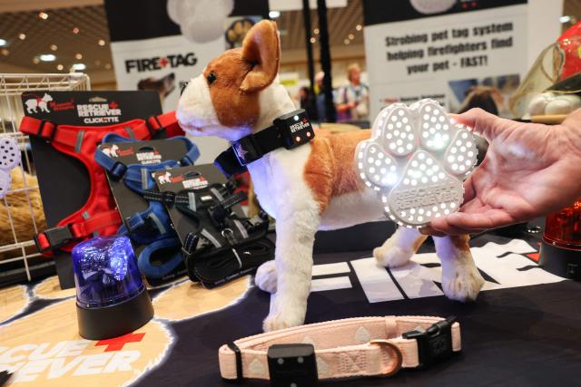 The Rescue Retriever Pet Smoke Detector, featuring a silent strobing smoke detector to help firefighters find pets in fires, is demonstrated during Pepcom ahead of the annual Consumer Electronics Show (CES) in Las Vegas, Nevada on January 5, 2026. (Photo by Patrick T. Fallon / AFP)