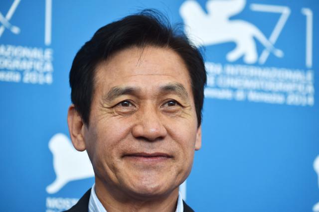 CORRECTION / South Korean actor Ahn Sung-Ki poses during the photocall of the movie "Hwajang" (Revivre) presented out of competition at the 71st Venice Film Festival on September 3, 2014 at Venice Lido.       AFP PHOTO / GABRIEL BOUYS (Photo by GABRIEL BOUYS / AFP) / “The erroneous mention[s] appearing in the metadata of this photo by GABRIEL BOUYS has been modified in AFP systems in the following manner: [South Korean actor Ahn Sung-Ki] instead of [South Korean film director Im Kwon-Taek]. Please immediately remove the erroneous mention[s] from all your online services and delete it (them) from your servers. If you have been authorized by AFP to distribute it (them) to third parties, please ensure that the same actions are carried out by them. Failure to promptly comply with these instructions will entail liability on your part for any continued or post notification usage. Therefore we thank you very much for all your attention and prompt action. We are sorry for the inconvenience this notification may cause and remain at your disposal for any further information you may require.”