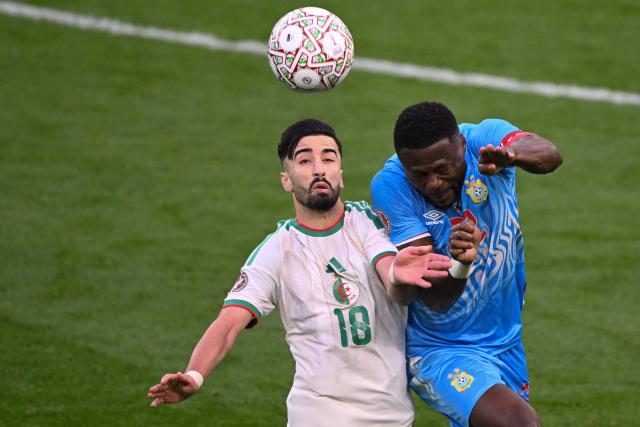Algeria's forward #18 Mohamed Amoura and Democratic Republic Of Congo's defender #22 Chancel Mbemba jump for the ball during the Africa Cup of Nations (CAN) round of 16 football match between Algeria and Democratic Republic of Congo at the Prince Moulay El Hassan
Stadium in Rabat on January 6, 2026. (Photo by SEBASTIEN BOZON / AFP)