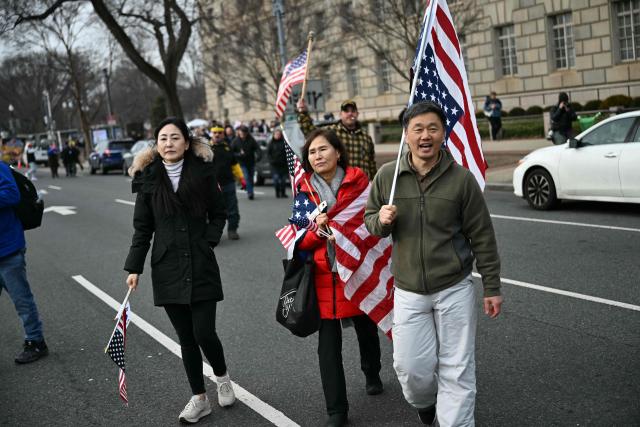 People attend a rally promoted by right-wing activists on the fifth anniversary of the January 6 riots in Washington, DC, on January 6, 2026. Washington on Tuesday marks five years since a mob overran the US Capitol, with rioters pardoned by Donald Trump retracing their steps even as Democrats revive hearings to hold the president accountable. The anniversary highlights a nation divided between irreconcilable accounts of an attack that reshaped American politics -- one supported by official findings of a violent bid to overturn an election, the other portraying it as a protest unjustly criminalized. (Photo by Brendan SMIALOWSKI / AFP)