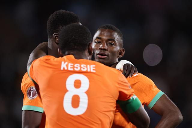 Ivory Coast's forward #24 Bazoumana Toure celebrates scoring the team's third goal during the Africa Cup of Nations (CAN) round of 16 football match between Ivory Coast and Burkina Faso at the Grand Stadium in Marrakesh on January 6, 2026. (Photo by FRANCK FIFE / AFP)