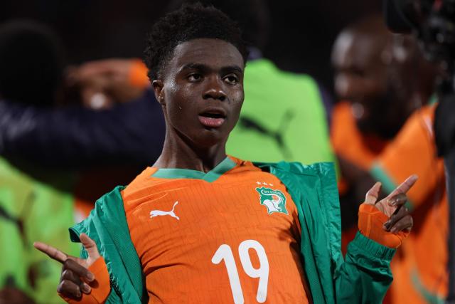 Ivory Coast's midfielder #19 Christ Inao Oulai celbrates as Ivory Coast's forward #24 Bazoumana Toure (unseen) celebrates scoring the team's third goal during the Africa Cup of Nations (CAN) round of 16 football match between Ivory Coast and Burkina Faso at the Grand Stadium in Marrakesh on January 6, 2026. (Photo by FRANCK FIFE / AFP)