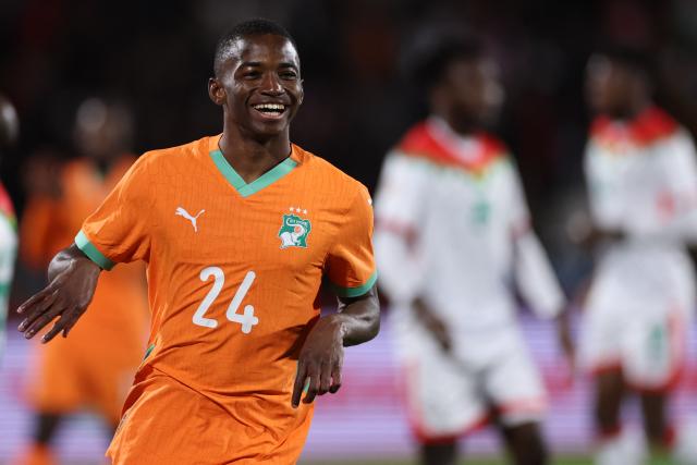 Ivory Coast's forward #24 Bazoumana Toure celebrates scoring the team's third goal during the Africa Cup of Nations (CAN) round of 16 football match between Ivory Coast and Burkina Faso at the Grand Stadium in Marrakesh on January 6, 2026. (Photo by FRANCK FIFE / AFP)