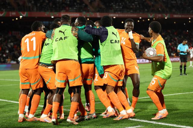 Ivory Coast players celebrate Ivory Coast's forward #24 Bazoumana Toure scoring the team's third goal during the Africa Cup of Nations (CAN) round of 16 football match between Ivory Coast and Burkina Faso at the Grand Stadium in Marrakesh on January 6, 2026. (Photo by Franck FIFE / AFP)