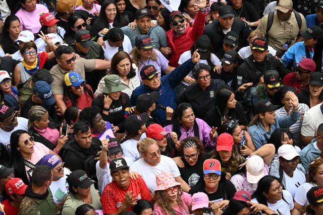 Venezuela's Minister of Interior Diosdado Cabello (C) attends a women's rally in support of ousted Venezuela's President Nicolas Maduro and his wife Cilia Flores in Caracas on January 6, 2026. US forces killed 55 Venezuelan and Cuban military personnel during their stunning raid to capture Nicolas Maduro, tolls published by Caracas and Havana showed January 6. (Photo by Federico PARRA / AFP)