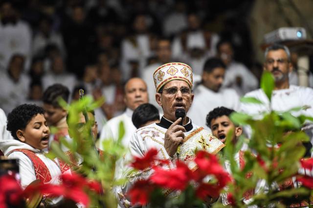 Egyptian Coptic Christians attend Christmas mass at the Saint Simon Monastery in Cairo’s mokattam mountain on January 6, 2026. (Photo by Ahmed HASAN / AFP)