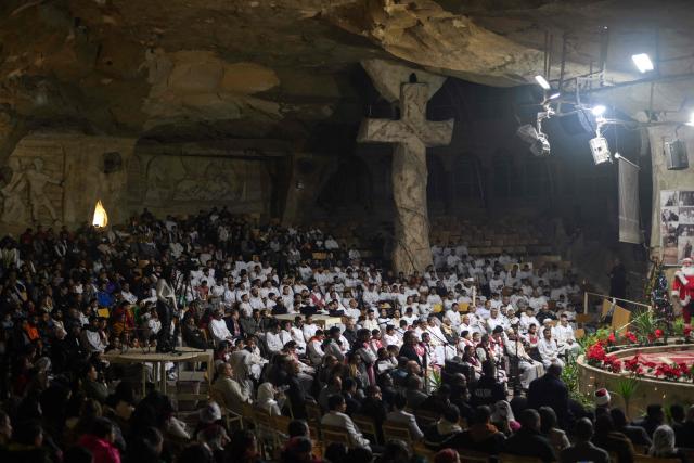 Egyptian Coptic Christians attend Christmas mass at the Saint Simon Monastery in Cairo’s mokattam mountain on January 6, 2026. (Photo by Ahmed HASAN / AFP)
