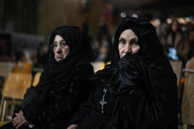 Egyptian Coptic Christians attend Christmas mass at the Saint Simon Monastery in Cairo’s mokattam mountain on January 6, 2026. (Photo by Ahmed HASAN / AFP)