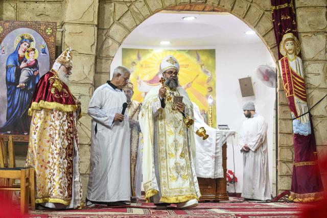 Egyptian Coptic Christians attend Christmas mass at the Saint Simon Monastery in Cairo’s mokattam mountain on January 6, 2026. (Photo by Ahmed HASAN / AFP)