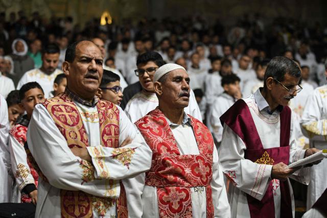 Egyptian Coptic Christians attend Christmas mass at the Saint Simon Monastery in Cairo’s mokattam mountain on January 6, 2026. (Photo by Ahmed HASAN / AFP)