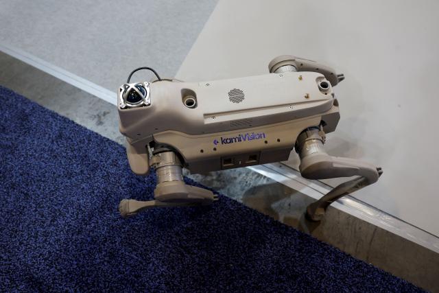 A Kami Vision ZL robot walks around at the annual Consumer Electronics Show (CES) in Las Vegas, Nevada, on January 6, 2026. Kami Vision specializes in smart security and senior safety solutions. (Photo by Caroline Brehman / AFP)