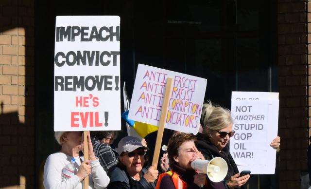 Activists gather to protest against US President Donald Trump's recent action in Venezuela on January 6, 2026 in Pasadena, California, calling on Congress for an immediate end to military action, accountability for President Trump's actions and diplomacy over war. Trump is exploring how to take control of Greenland and using the US military is "always an option," the White House said Tuesday, further upping tensions with NATO ally Denmark. Washington's stark warning came despite Greenland and Denmark both calling for a speedy meeting with the United States to clear up "misunderstandings." The US military intervention in Venezuela has reignited Trump's designs on the autonomous Danish territory in the Arctic, which has untapped rare earth deposits and could be a vital player as melting polar ice opens up new shipping routes. (Photo by Frederic J. BROWN / AFP)