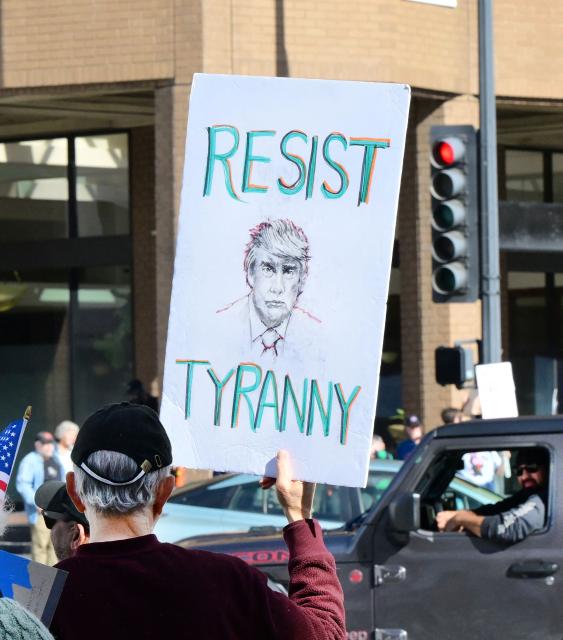 Activists gather to protest against US President Donald Trump's recent action in Venezuela on January 6, 2026 in Pasadena, California, calling on Congress for an immediate end to military action, accountability for President Trump's actions and diplomacy over war. Trump is exploring how to take control of Greenland and using the US military is "always an option," the White House said Tuesday, further upping tensions with NATO ally Denmark. Washington's stark warning came despite Greenland and Denmark both calling for a speedy meeting with the United States to clear up "misunderstandings." The US military intervention in Venezuela has reignited Trump's designs on the autonomous Danish territory in the Arctic, which has untapped rare earth deposits and could be a vital player as melting polar ice opens up new shipping routes. (Photo by Frederic J. BROWN / AFP)