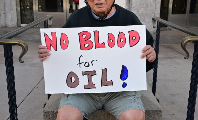 Activists gather to protest against US President Donald Trump's recent action in Venezuela on January 6, 2026 in Pasadena, California, calling on Congress for an immediate end to military action, accountability for President Trump's actions and diplomacy over war. Trump is exploring how to take control of Greenland and using the US military is "always an option," the White House said Tuesday, further upping tensions with NATO ally Denmark. Washington's stark warning came despite Greenland and Denmark both calling for a speedy meeting with the United States to clear up "misunderstandings." The US military intervention in Venezuela has reignited Trump's designs on the autonomous Danish territory in the Arctic, which has untapped rare earth deposits and could be a vital player as melting polar ice opens up new shipping routes. (Photo by Frederic J. BROWN / AFP)