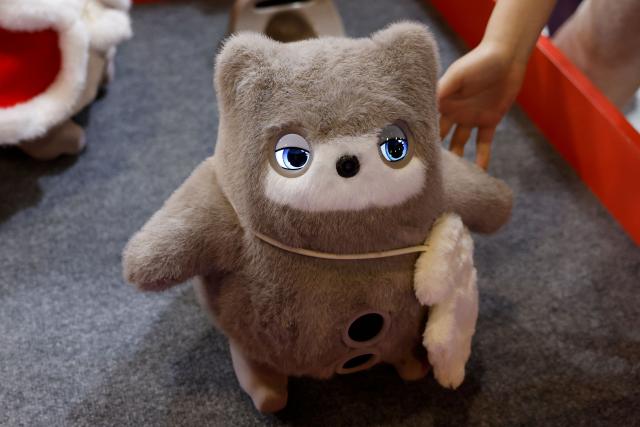 SwitchBot’s KATA Friends, AI companions with a camera nose that is designed to interact with users through voice, gestures, and cloud AI, are on display at the annual Consumer Electronics Show (CES) in Las Vegas, Nevada, on January 6, 2026. (Photo by Caroline Brehman / AFP)