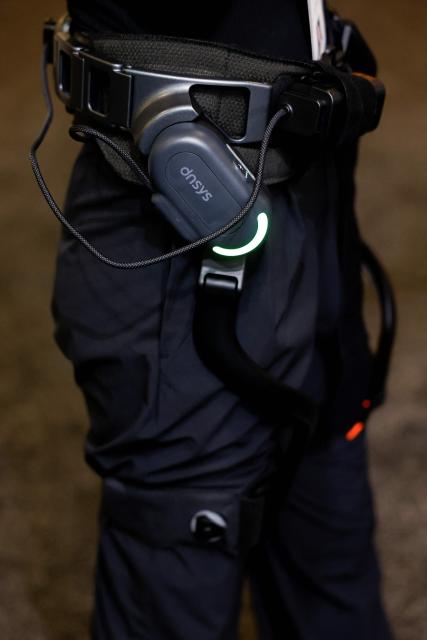 A person tries out the dnsys X1 hip exoskeleton at the annual Consumer Electronics Show (CES) in Las Vegas, Nevada, on January 6, 2026. (Photo by Caroline Brehman / AFP)
