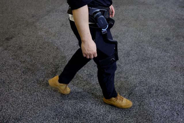 A person tries out the dnsys X1 hip exoskeleton at the annual Consumer Electronics Show (CES) in Las Vegas, Nevada, on January 6, 2026. (Photo by Caroline Brehman / AFP)