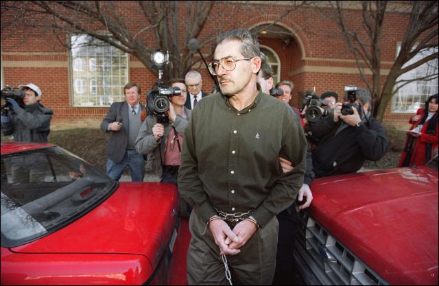 (FILES) Former senior Central Intelligence Agency office Aldrich Hazen Ames is led from US Federal Courthouse in Alexandria, 22 February 1994, after being arraigned on charges of spying for the former Soviet Union. Aldrich Ames, the Central Intelligence Agency spy who was sentenced to life in prison for selling secrets to Moscow, costing the lives of a dozen double agents, died January 5 in custody, US authorities said.
He was 84, according to the Bureau of Prisons. (Photo by LUKE FRAZZA / AFP)
