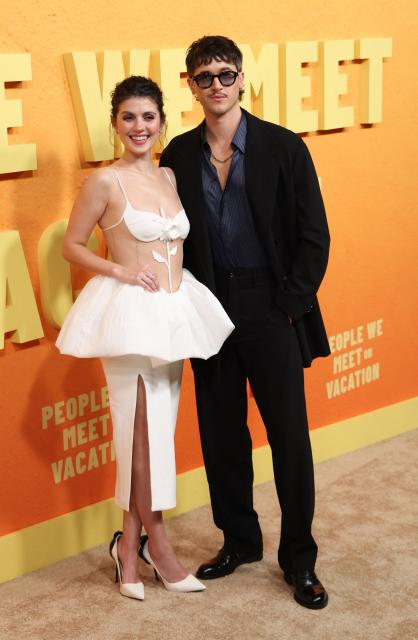 US actress Emily Bader and English actor Tom Blyth attend the Netflix premiere of "People We Meet on Vacation" at the Egyptian theatre in Hollywood, California on January 6, 2026. (Photo by Michael Tran / AFP)