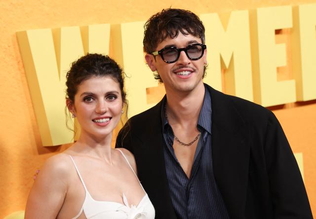 US actress Emily Bader and English actor Tom Blyth attend the Netflix premiere of "People We Meet on Vacation" at the Egyptian theatre in Hollywood, California on January 6, 2026. (Photo by Michael Tran / AFP)