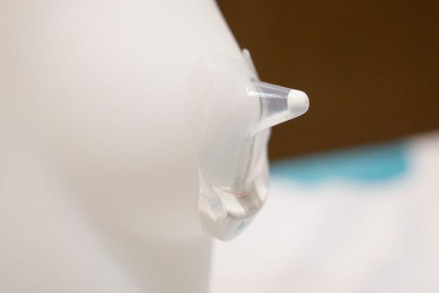 An exhibitor displays Coroflo’s “Coro” breastfeeding monitor, which uses a micro flow meter in a slimline silicone nipple shield to measure milk intake, during the ShowStoppers event at the annual Consumer Electronics Show (CES) in Las Vegas, Nevada, on January 6, 2026. (Photo by Caroline Brehman / AFP)