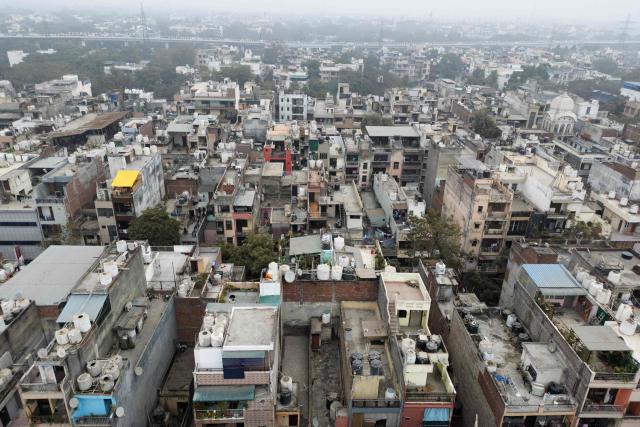 An aerial view shows residential buildings in New Delhi on January 7, 2026. (Photo by Sajjad HUSSAIN / AFP)