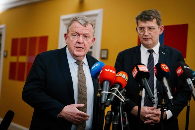 Denmark's Foreign Minister Lars Loekke Rasmussen (L) and Defense Minister Troels Lund Poulsen talk to journalists after a meeting in the Foreign Policy Committee in Copenhagen on January 6, 2026. (Photo by Emil Nicolai Helms / Ritzau Scanpix / AFP) / Denmark OUT