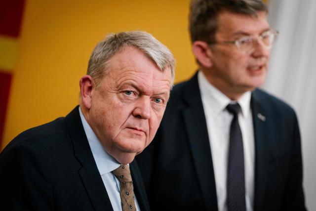 Denmark's Foreign Minister Lars Loekke Rasmussen (L) and Defense Minister Troels Lund Poulsen talk to journalists after a meeting in the Foreign Policy Committee in Copenhagen on January 6, 2026. (Photo by Emil Nicolai Helms / Ritzau Scanpix / AFP) / Denmark OUT