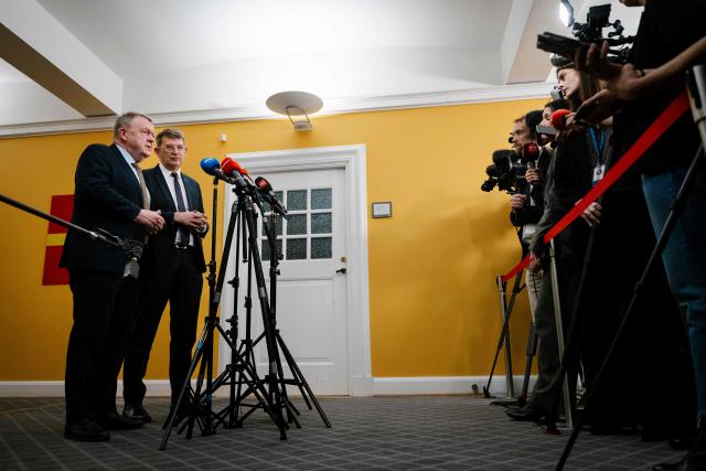 Denmark's Foreign Minister Lars Loekke Rasmussen (L) and Defense Minister Troels Lund Poulsen talk to journalists after a meeting in the Foreign Policy Committee in Copenhagen on January 6, 2026. (Photo by Emil Nicolai Helms / Ritzau Scanpix / AFP) / Denmark OUT