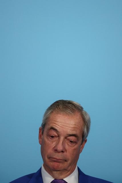 Reform UK leader, Nigel Farage, attends a party press conference in London on January 7, 2026. (Photo by HENRY NICHOLLS / AFP)