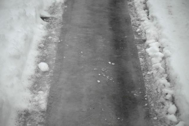 This photograph shows ice covers the entrance to the toll plaza on the A10 motorway near Saintes, western France, on January 7, 2026, following snowfalls. (Photo by Philippe LOPEZ / AFP)