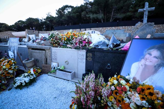 Wreath of flowers and photographs of late French actress Brigitte Bardot are pictured around her grave at the marine cemetery, following the funeral ceremony at Notre-Dame de l'Assomption church, in Saint-Tropez, southeastern France, on January 7, 2026. French film sensation Brigitte Bardot, a symbol of sexual liberation in the 1950s and 1960s who reinvented herself as an animal rights defender and embraced far-right views, died on December 28, 2025 aged 91. (Photo by Valery HACHE / AFP)