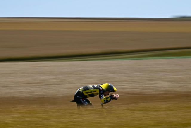 (FILES) Team Visma - Lease a bike team's British rider Simon Yates cycles during the 5th stage of the 112th edition of the Tour de France cycling race, 33 km individual time trial starting and finishing in Caen, northwestern France, on July 9, 2025. Two-time Grand Tour winner Simon Yates announced on January 7, 2026 that he was retiring from professional cycling, just seven months after winning the Giro d'Italia. The news comes after Yates enjoyed probably the best season of his career, following up his stunning Giro success with a stage victory at July's Tour de France. (Photo by Loic VENANCE / AFP)