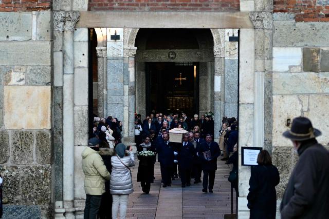 Pallbearers carry the coffin of Achille Barosi, 16 years old, one of the Italian victims of the Crans-Montana new-year fire, at the end of the funeral outside the Basilica of Sant'Ambrogio, in Milan on January 7, 2026. (Photo by Stefano RELLANDINI / AFP)
