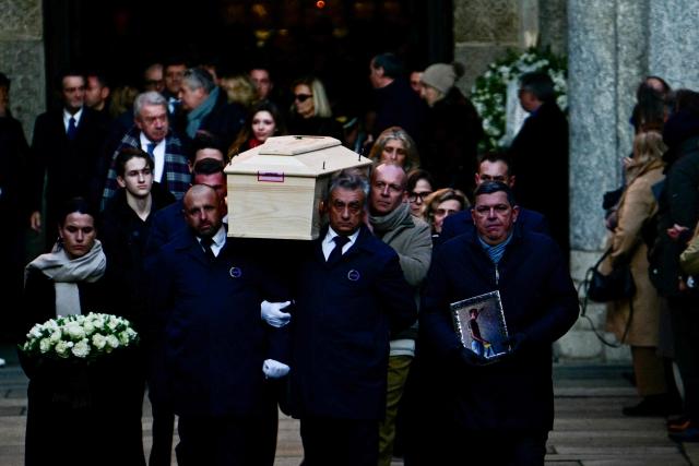 Pallbearers carry the coffin of Achille Barosi, 16 years old, one of the Italian victims of the Crans-Montana new-year fire, at the end of the funeral outside the Basilica of Sant'Ambrogio, in Milan on January 7, 2026. (Photo by Stefano RELLANDINI / AFP)