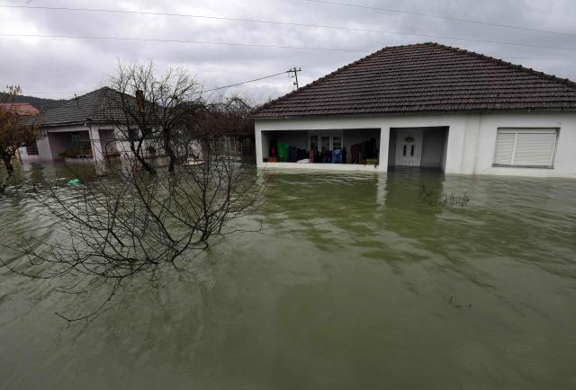 Flooded houses and homesteads are seen in Danilovgrad, on January 7, 2026. River Zeta has flooded the areas of Danilovgrad and village of Spuz, just north of the capital Podgorica, following heavy rains over the area. (Photo by SAVO PRELEVIC / AFP)