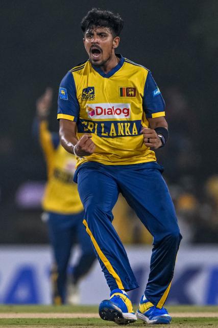 Sri Lanka's Maheesh Theekshana celebrates after taking the wicket of Pakistan's Saim Ayub during the first Twenty20 international cricket match between Sri Lanka and Pakistan at the Rangiri Dambulla International Stadium in Dambulla on January 7, 2026. (Photo by Ishara S. KODIKARA / AFP)