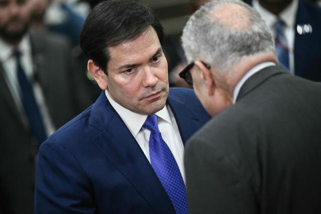 (L/R) US Secretary of State Marco Rubio speaks with Senate Minority Leader Chuck Schumer, Democrat from New York, after Rubio and top Trump administration officials briefed Senators on the recent US military actions in Venezuela, at the US Capitol in Washington, DC on January 7, 2026. (Photo by Brendan SMIALOWSKI / AFP)