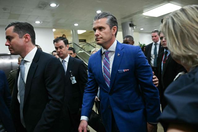 US Secretary of Defense Pete Hegseth departs after speaking to reporters after briefing Senators on the recent US military actions in Venezuela, on Capitol Hill in Washington, DC on January 7, 2026. (Photo by Brendan SMIALOWSKI / AFP)