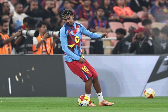 Barcelona's Spanish forward #10 Lamine Yamal during warm up ahead of the Spanish Supercup semi-final football match between FC Barcelona and Athletic Bilbao at King Abdullah Sports City in Jeddah on January 7, 2026. (Photo by Fadel SENNA / AFP)