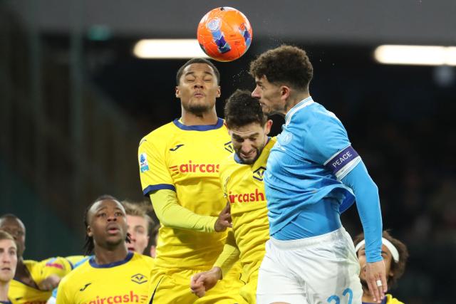 Napoli's Italian defender #22 Giovanni Di Lorenzo jumps for the ball during the Italian Serie A football match between Napoli and Hellas Verona at the Diego Armando Maradona stadium in Naples on January 7, 2026. (Photo by Carlo Hermann / AFP)