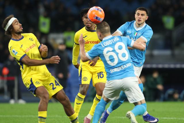 Napoli's Slovak midfielder #68 Stanislav Lobotka fights for the ball with Hellas Verona's French midfielder #24 Antoine Bernede and Hellas Verona's Nigerian forward #16 Gift Orban during the Italian Serie A football match between Napoli and Hellas Verona at the Diego Armando Maradona stadium in Naples on January 7, 2026. (Photo by Carlo Hermann / AFP)