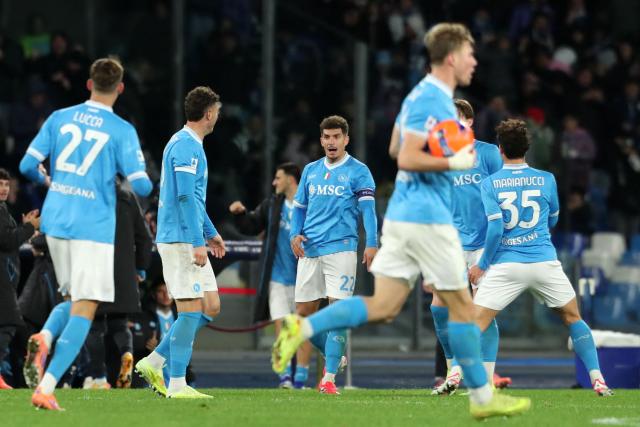 Napoli's Italian defender #22 Giovanni Di Lorenzo celebrates with teammates after scoring his team's second goal during the Italian Serie A football match between Napoli and Hellas Verona at the Diego Armando Maradona stadium in Naples on January 7, 2026. (Photo by Carlo Hermann / AFP)
