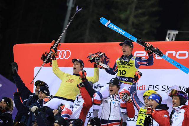 First placed France's Clement Noel (L) celebrates with third placed France's Paco Rassat after the Men's Slalom event, part of the FIS Alpine Ski World Cup 2025-2026, in Madonna di Campiglio, northern Italy, on January 7, 2026. (Photo by Pierre TEYSSOT / AFP)