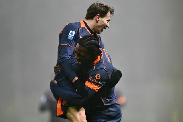 Inter Milan's French forward #9 Marcus Thuram celebrates scoring his team's second goal with Inter Milan's Italian midfielder #23 Nicolo Barella during the Italian Serie A football match between Parma and Inter Milan at the Ennio Tardini stadium in Parma on January 7, 2026. (Photo by Marco BERTORELLO / AFP)
