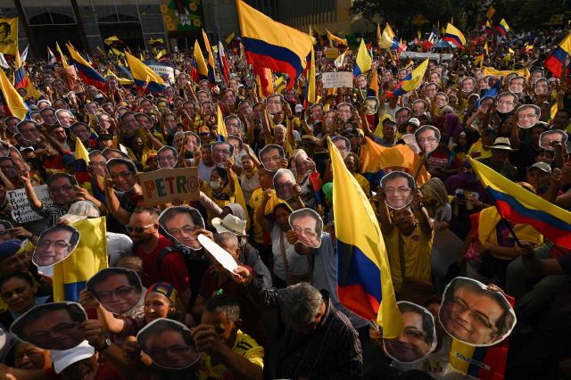 People take part in the March for Sovereignty and Democracy against US President Donald Trump's threats to Colombia's President Gustavo Petro in Cali, Colombia on January 7, 2026. On January 5, Colombian President Gustavo Petro said he was ready to "take up arms" in the face of threats from US counterpart Donald Trump, who over the weekend seized the leader of neighboring Venezuela in a military strike. (Photo by Joaquin SARMIENTO / AFP)
