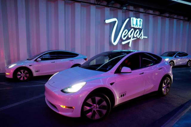 A Tesla electric vehicle transports passengers through the Las Vegas Convention Center Loop during the annual Consumer Electronics Show (CES) in Las Vegas, Nevada, on January 6, 2026. (Photo by Caroline Brehman / AFP)