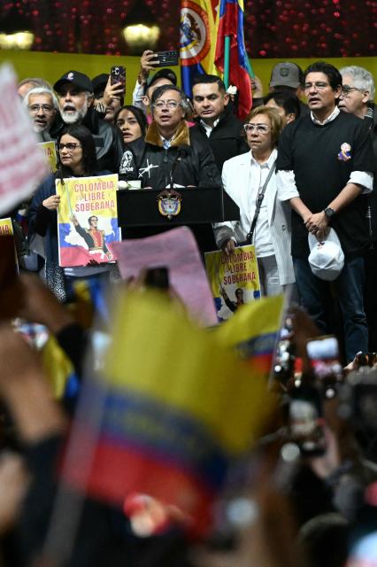 Colombia’s President Gustavo Petro sings the national anthem during the March for Sovereignty and Democracy against US President Donald Trump’s threats to Petro at Bolivar Square in Bogota on January 7, 2026. Donald Trump held his first phone call with Colombian counterpart Gustavo Petro on January 7, the foreign ministry in Bogota said, days after the US President threatened him with military action. (Photo by Luis ACOSTA / AFP)